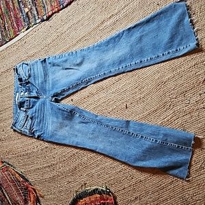 Pacsun bootcut, low rise, stretch jean. Raw hem style.  Size 27